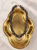 Zebra Necklace on gold shell dish