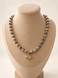 Dalmatian Necklace displayed on a jewelry bust