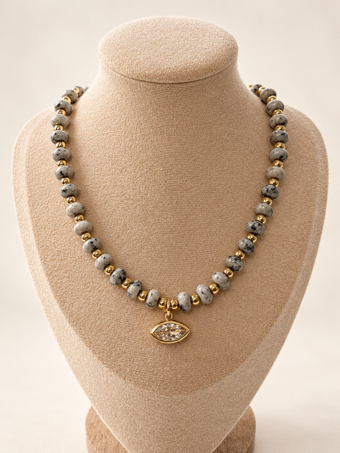 Dalmatian Necklace displayed on a jewelry bust