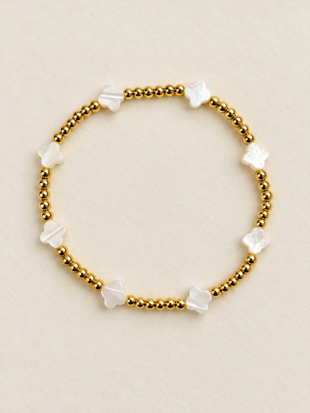 Gold-tone and white clover bead bracelet
