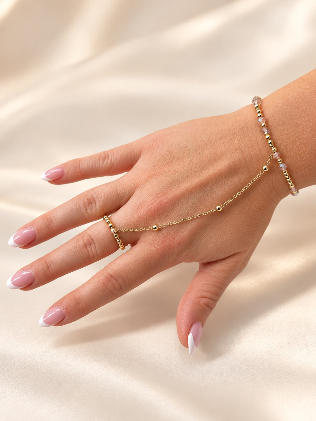 14k gold filled hand chain with blush and gold beaded wrist and finger rings