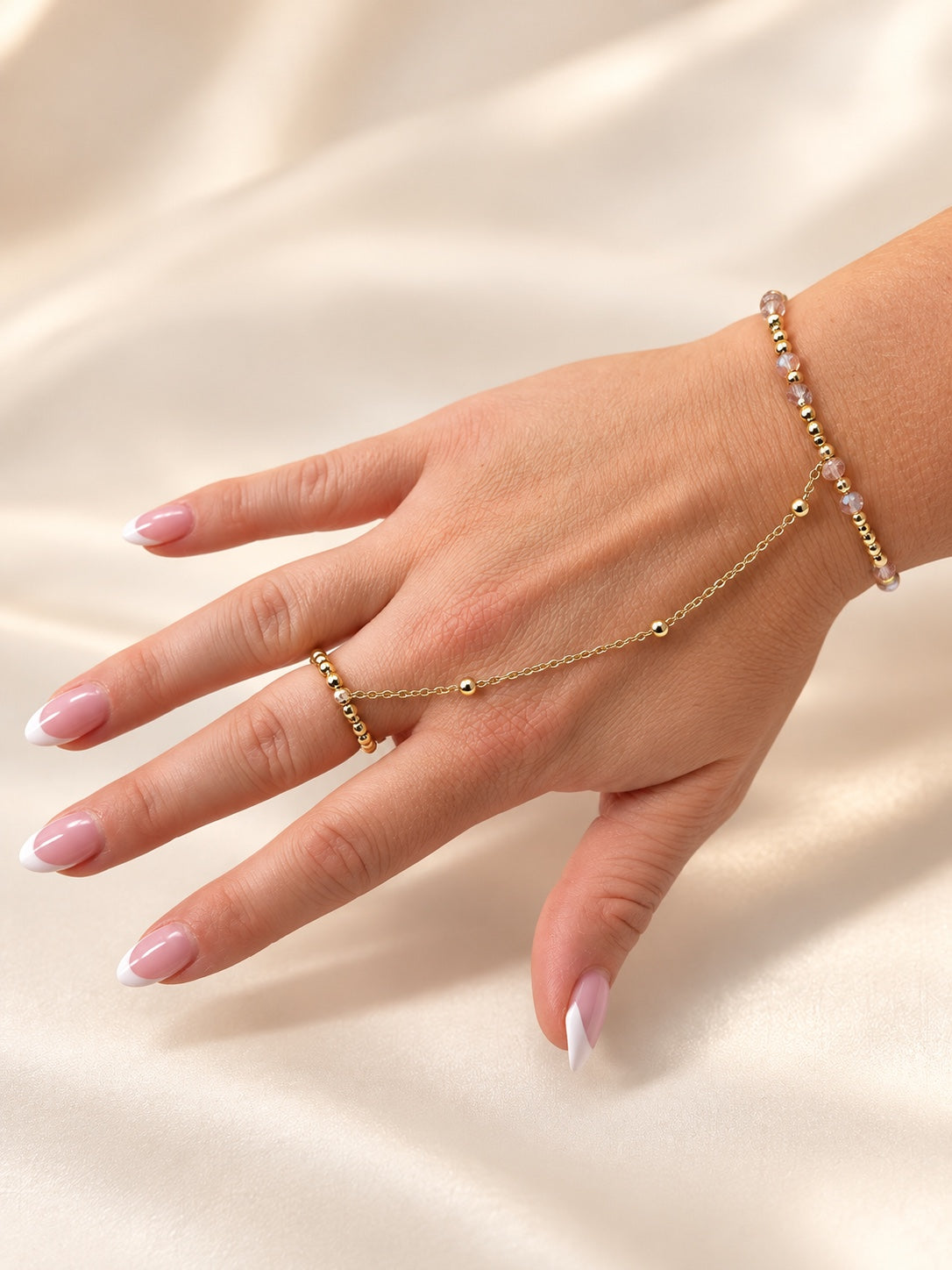 14k gold filled hand chain with blush and gold beaded wrist and finger rings