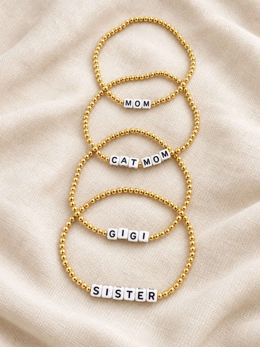Custom name bracelet photo featuring gold beaded personalized bracelets
