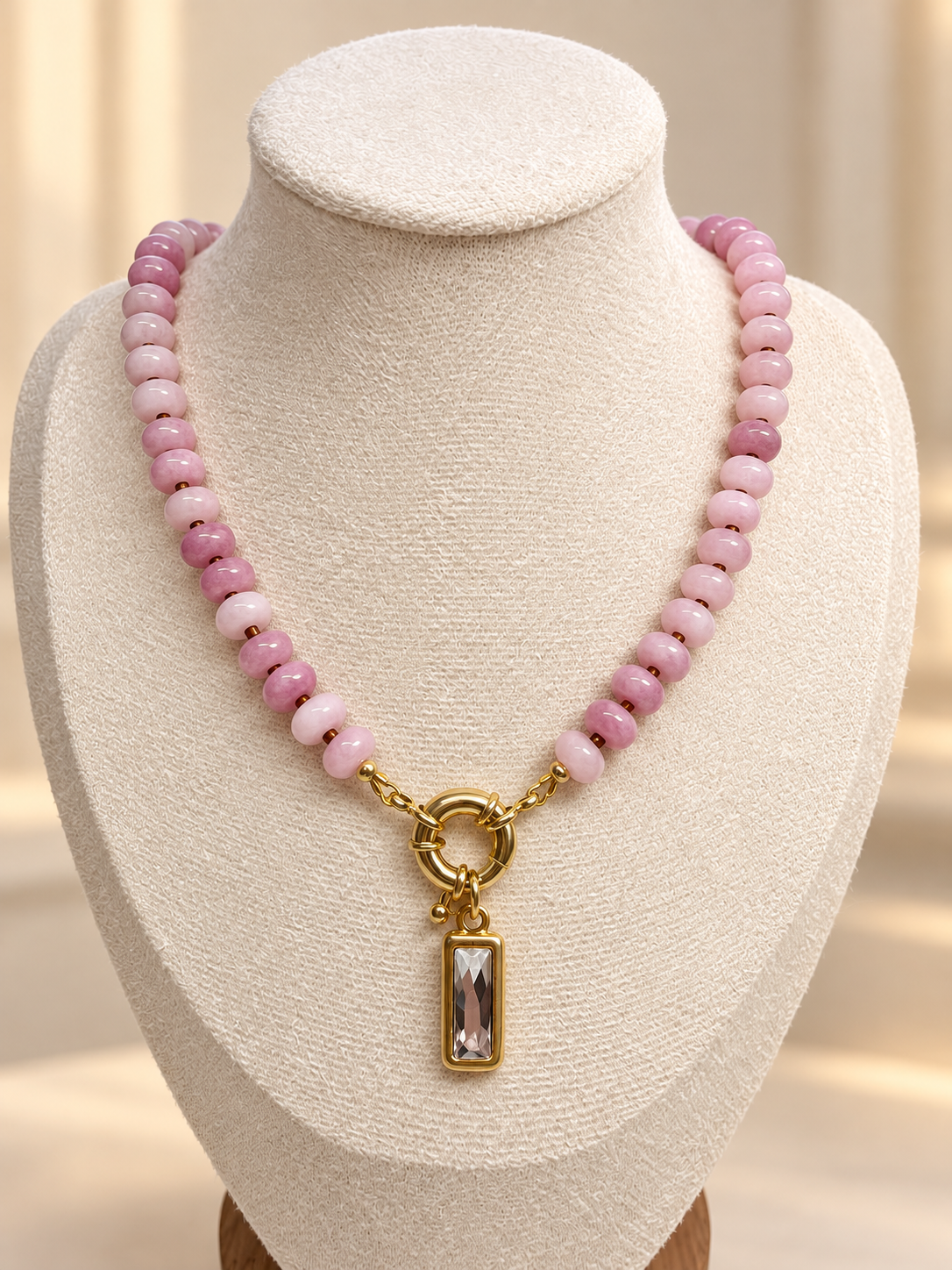 The Rose Necklace shown with an optional charm