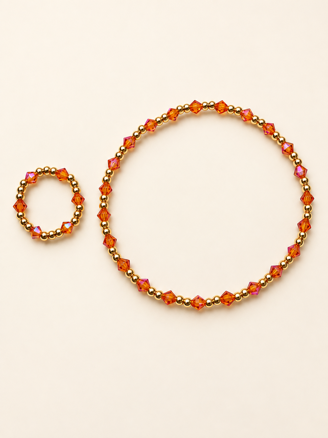 Topaz bracelet and matching ring on a clean ivory background