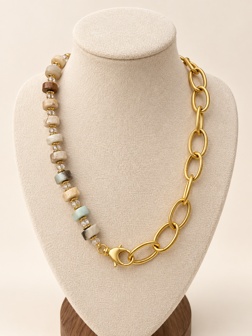 Golden Earth Link Necklace on an ivory display bust