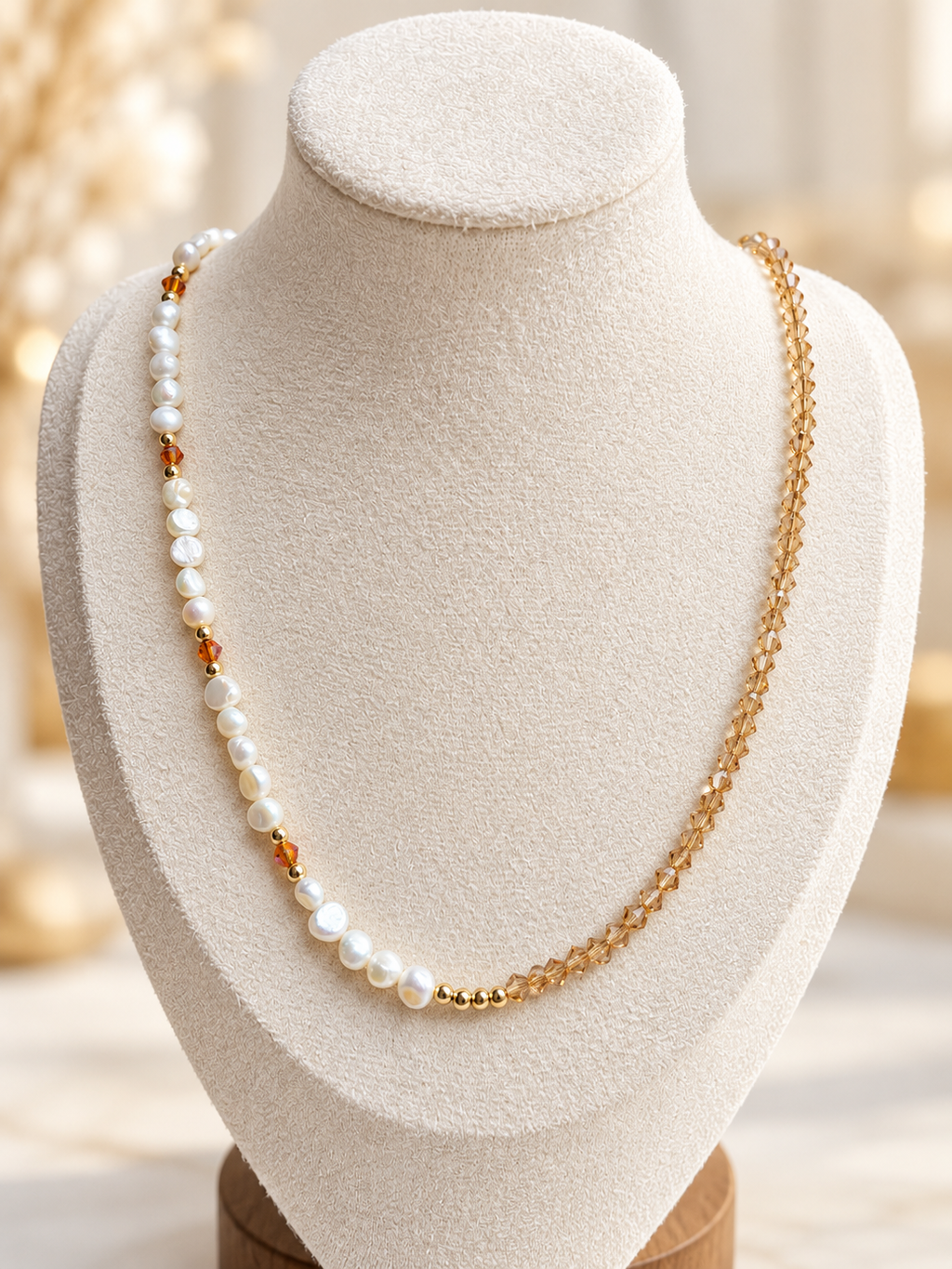 Honey Pearl Necklace displayed on an ivory jewelry bust
