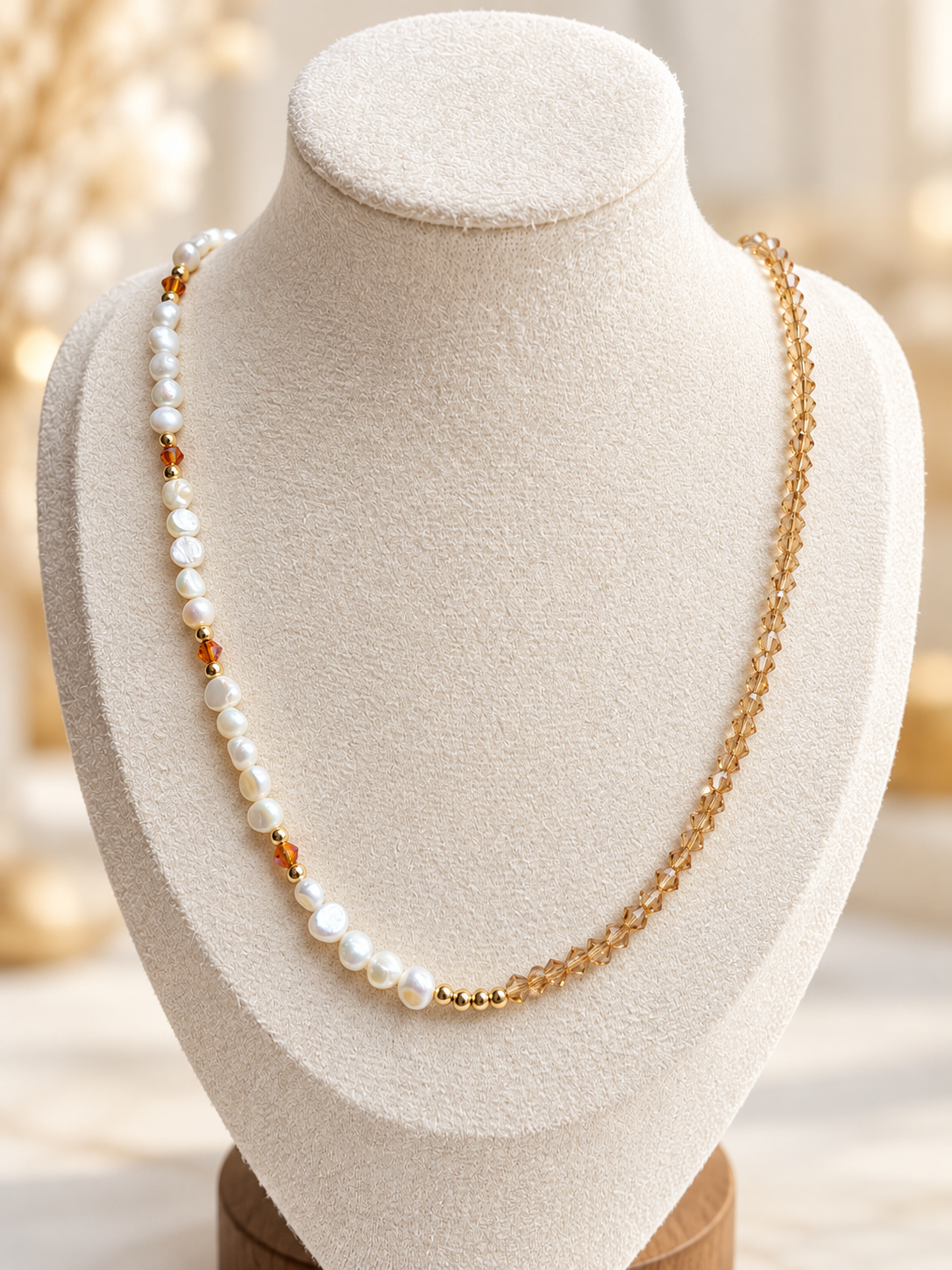 Honey Pearl Necklace displayed on an ivory jewelry bust
