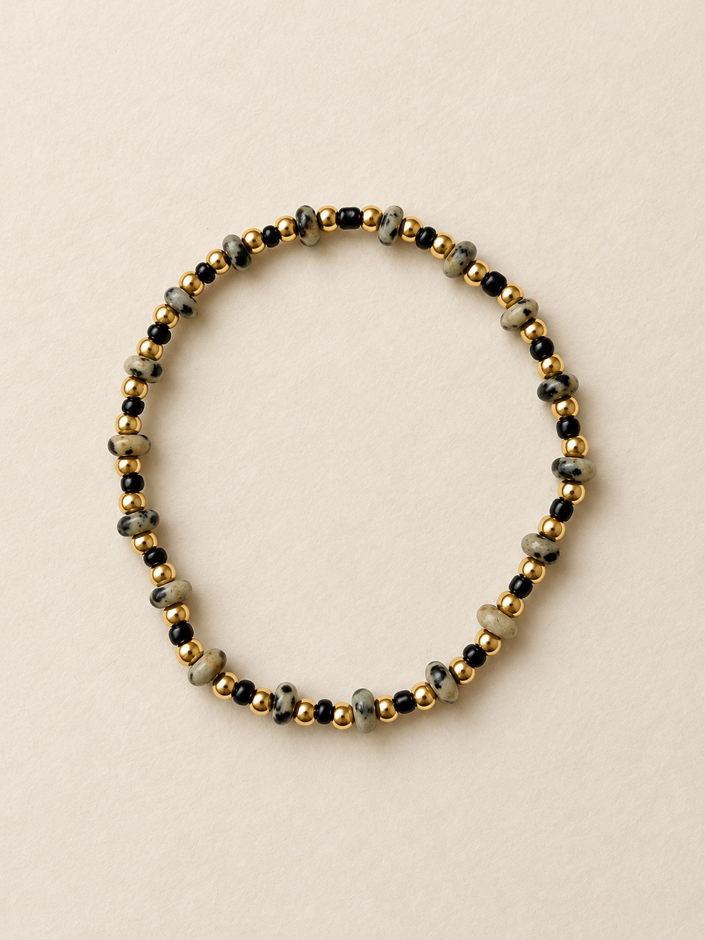 Mini Dalmatian bracelet on a warm ivory backdrop
