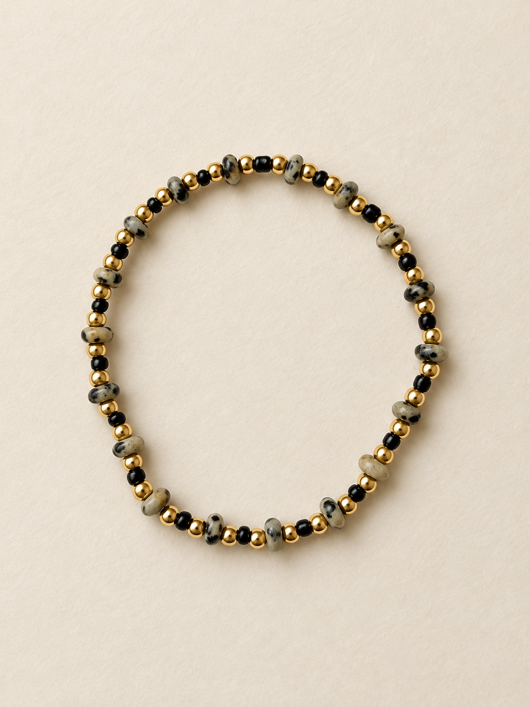 Mini Dalmatian bracelet on a warm ivory backdrop