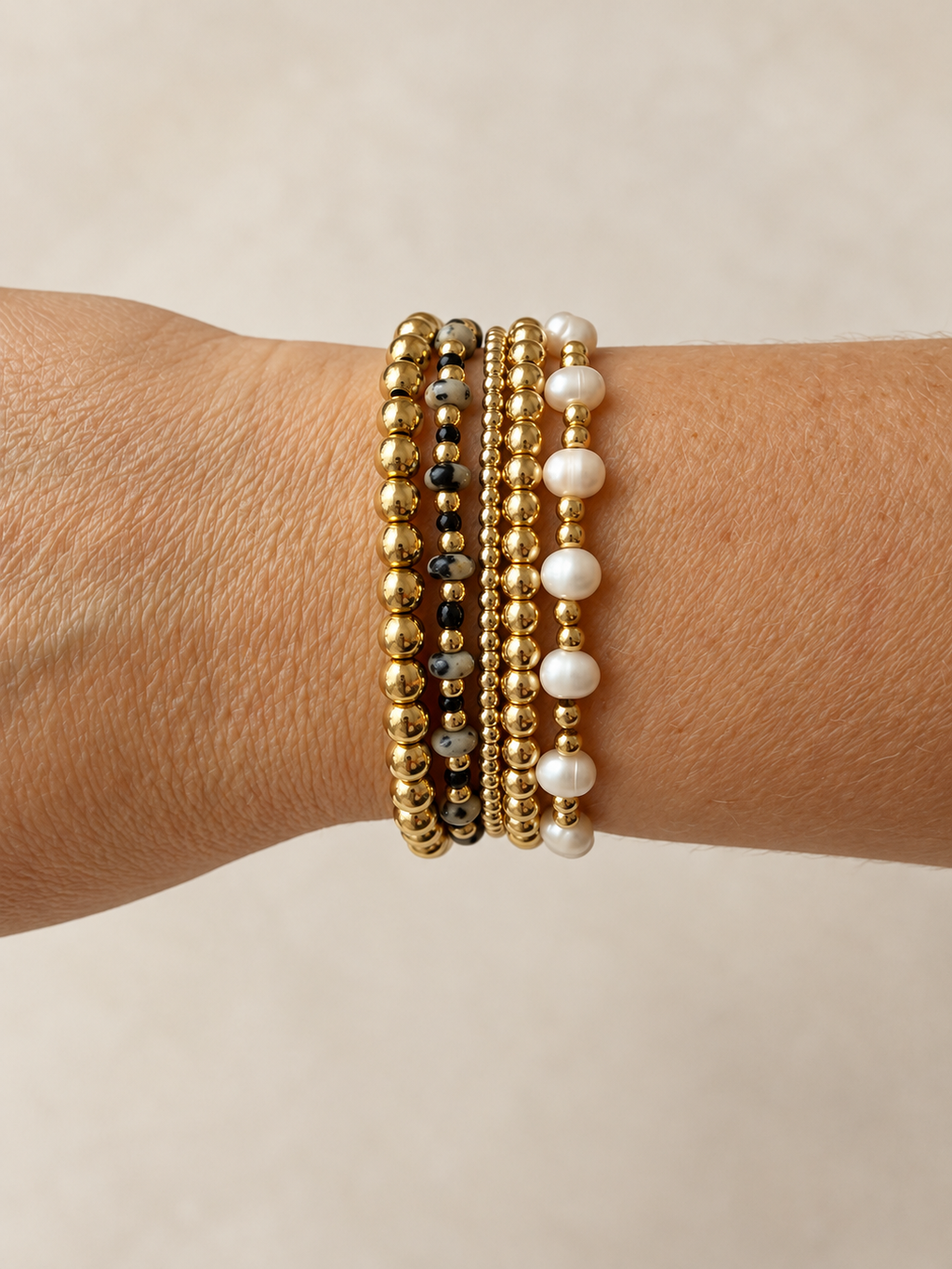 Mini Dalmatian bracelet shown stacked on the wrist