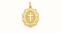 Single ornate gold-tone cross charm on off-white