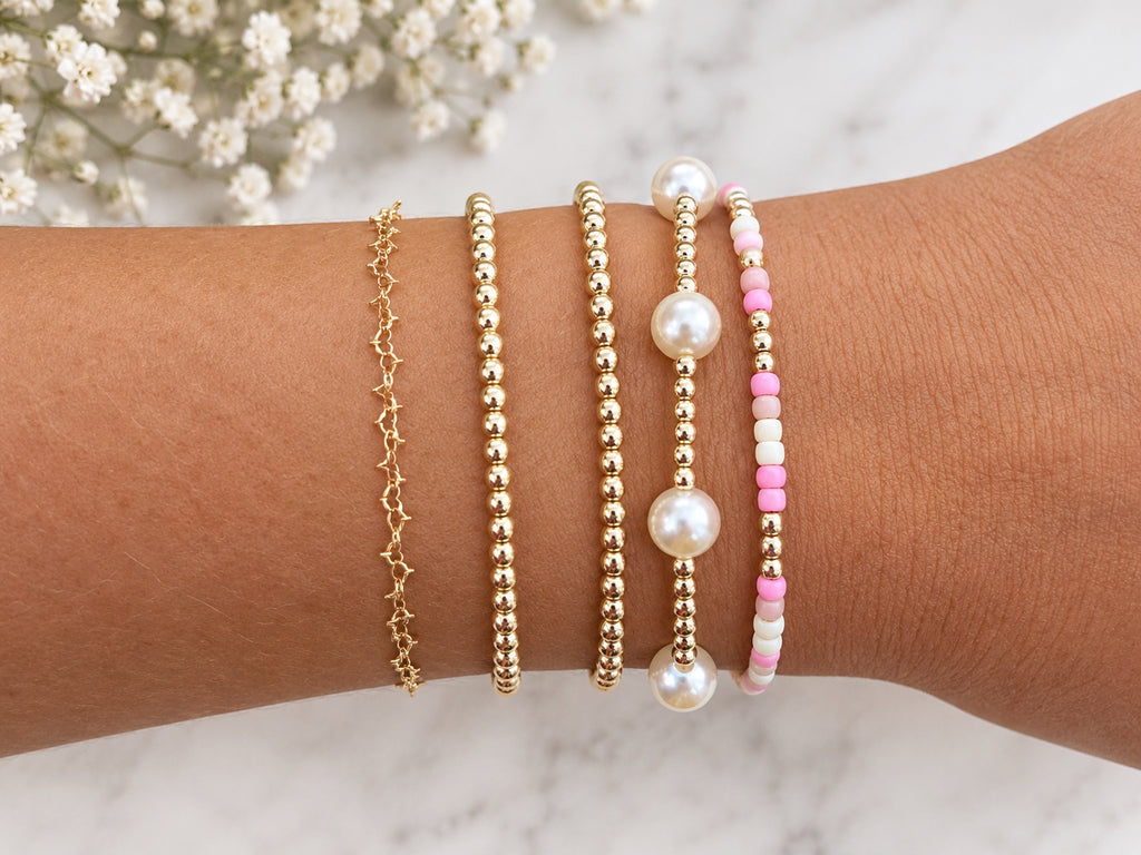 Pink seed beads, pearls, and gold accents for custom bracelet inspiration