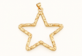 Single open gold-tone star charm on off-white